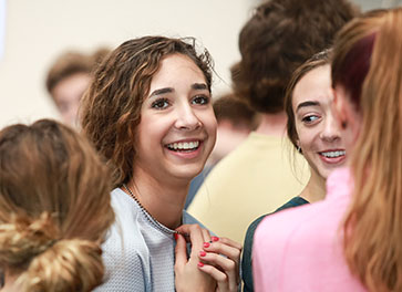 Photo of students smiling.